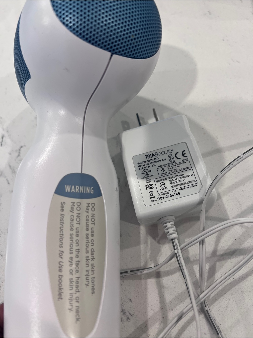 White and Blue Handheld Laser Hair Removal Device - Picture 2 of 4